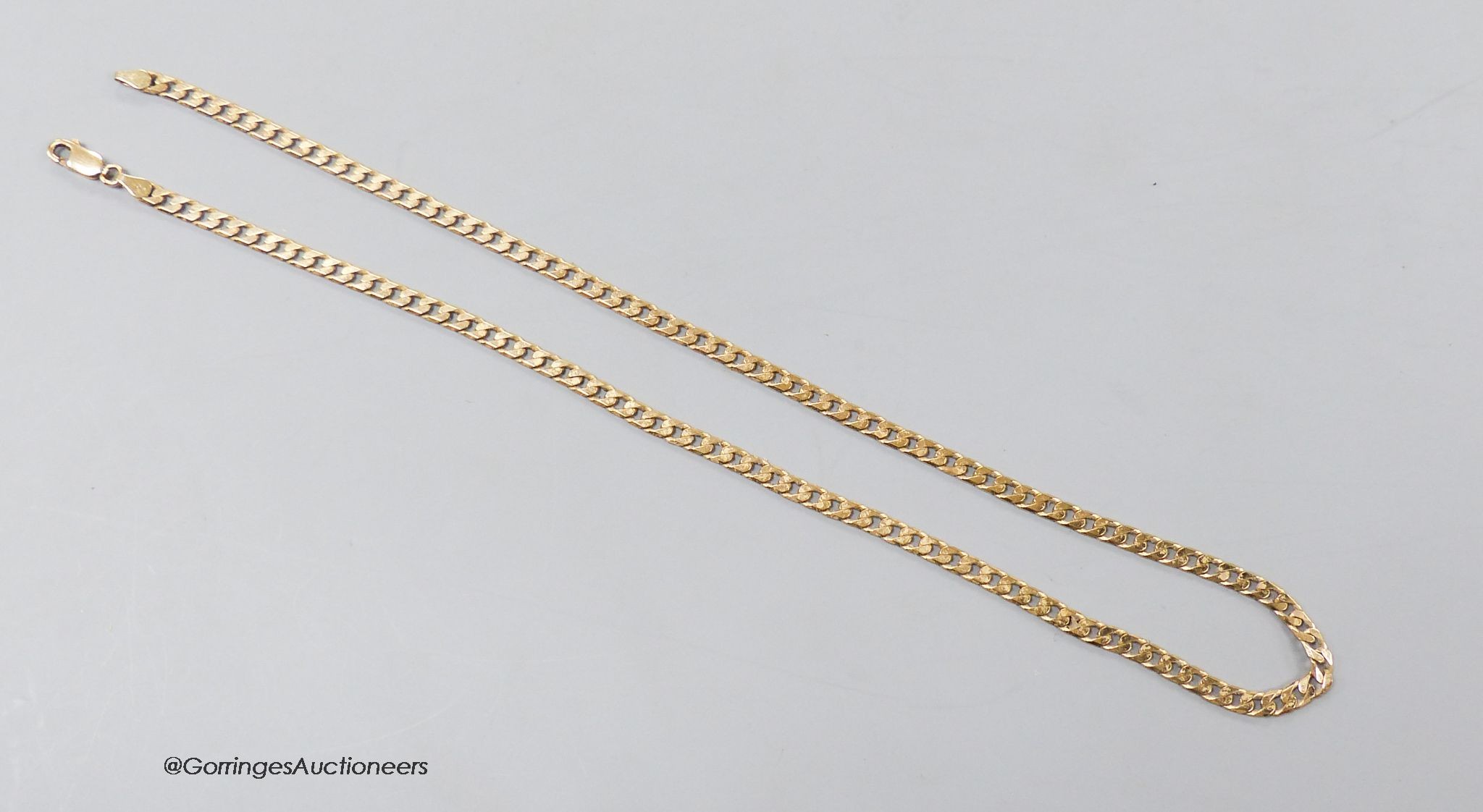 A 9ct gold flattened curb-link necklace, 47cm, 14.3 grams.